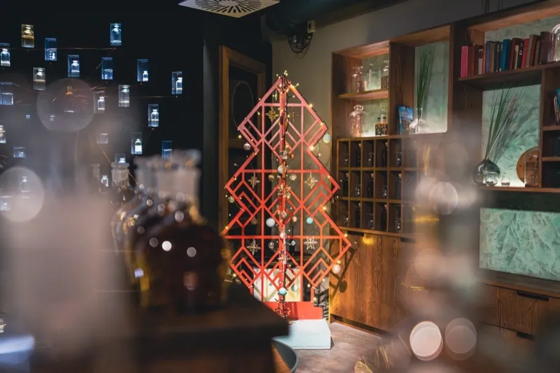 Geometric red Christmas tree display at Roe and Co distillery